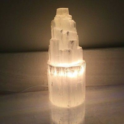 Thornbury selenite crystal lamp, photographed on a warm neutral surface