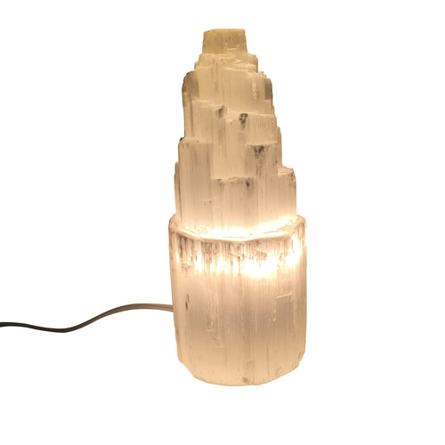 Thornbury selenite crystal lamp, photographed on a warm neutral surface